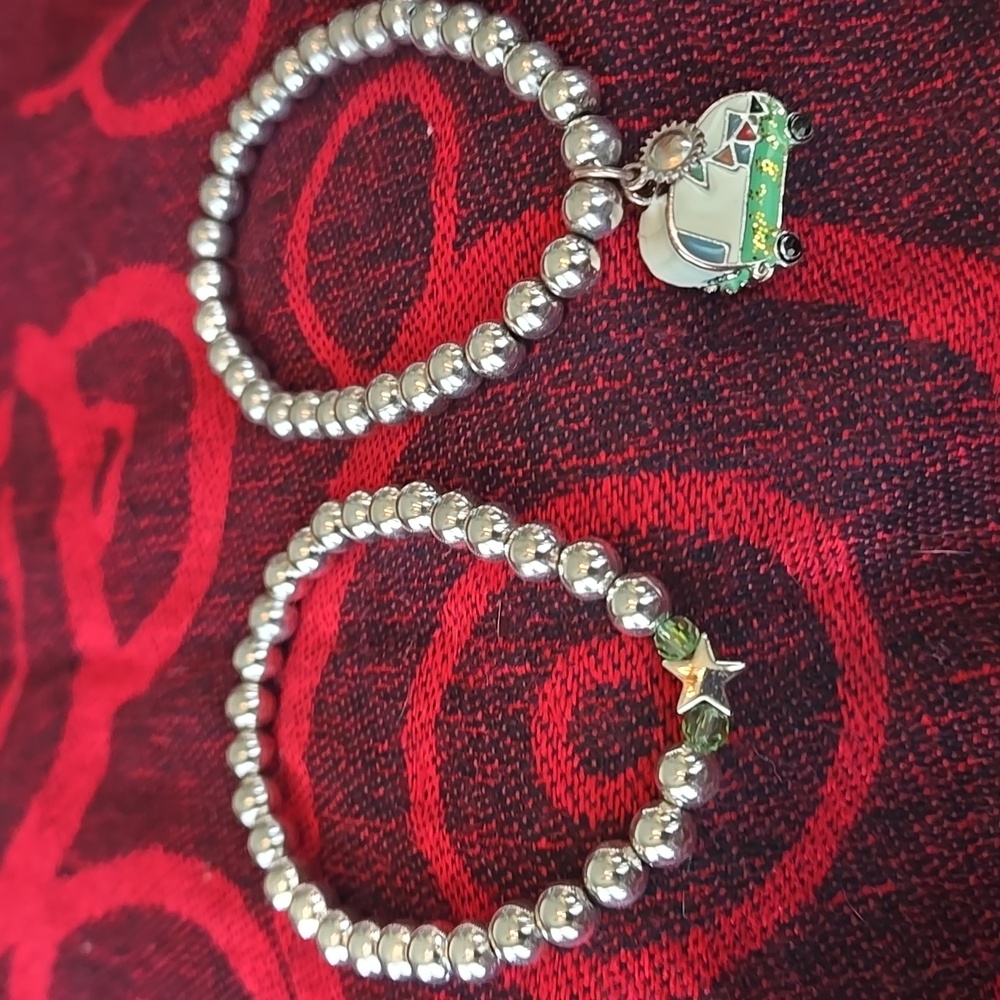 2 Silver Tone Bead, stretch Bracelets with retro Trailer and Star Charms